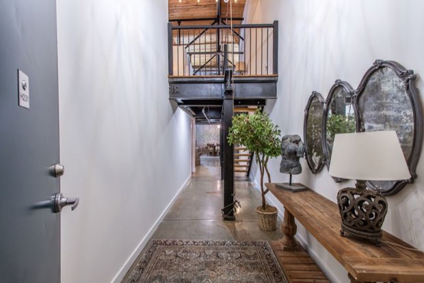 Entry hall looking in from the door, with the mezzanine overhead