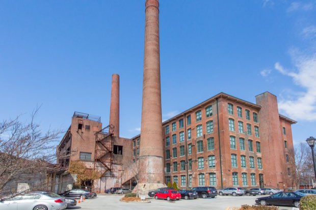 Exterior of the Fulton Cotton Mill and its brick smokestacks