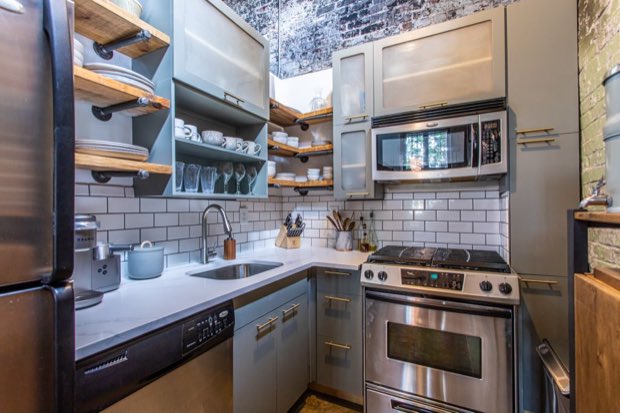 Kitchen counter with a quartz worktop, undermount sink and open shelving