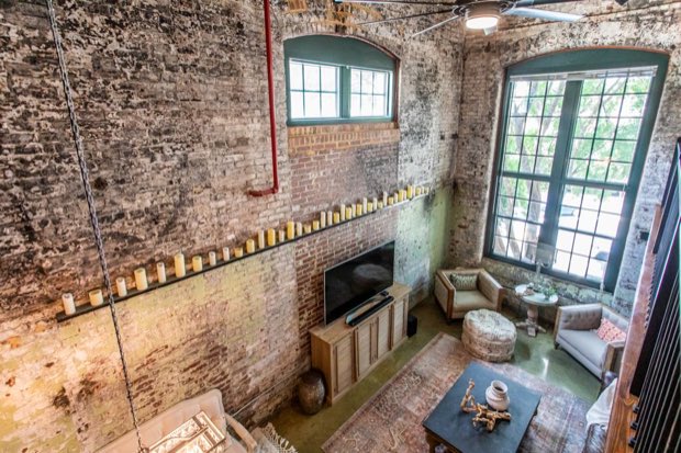 View down from the mezzanine to the living room and candle rail