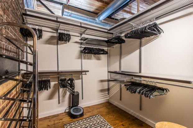 Walk-in closet with built-in hanging rails and shelving