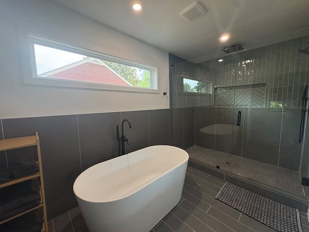 Primary bathroom with a freestanding tub and glass walk-in shower