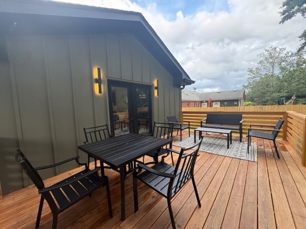 Deck dining table for four, with lounge seating beyond