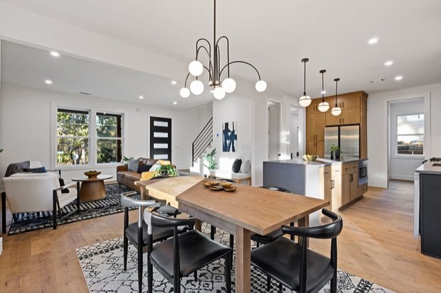 Dining area seating six alongside the open kitchen