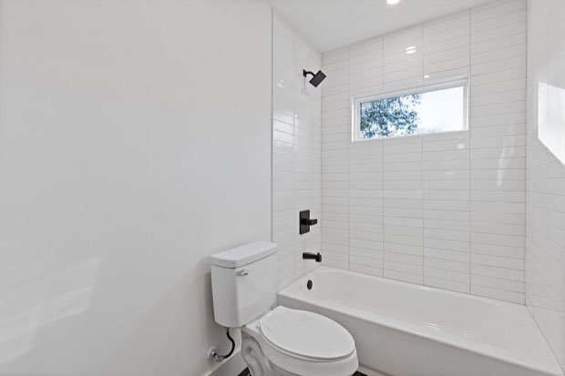 Full bathroom with a tub and shower